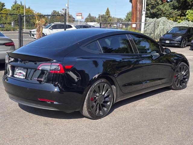 Photo of 2022 Black Tesla Model 3