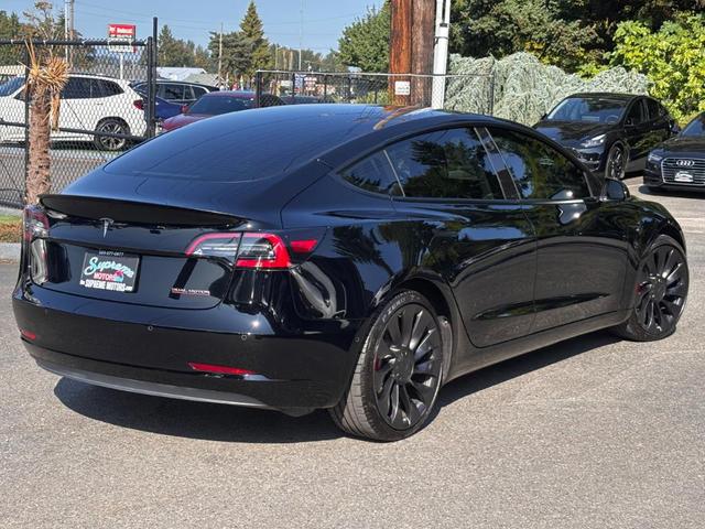 Photo of 2022 Black Tesla Model 3