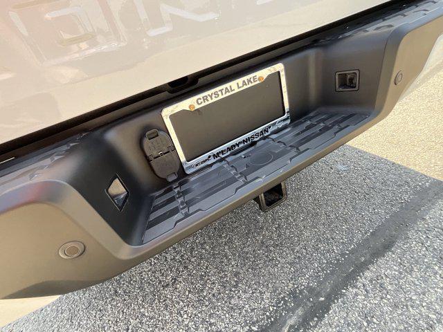 Photo of 2025 Glacier White Nissan Frontier