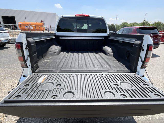 Photo of 2025 Glacier White Nissan Frontier