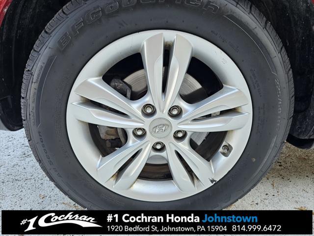 Photo of 2011 Garnet Red Hyundai TUCSON