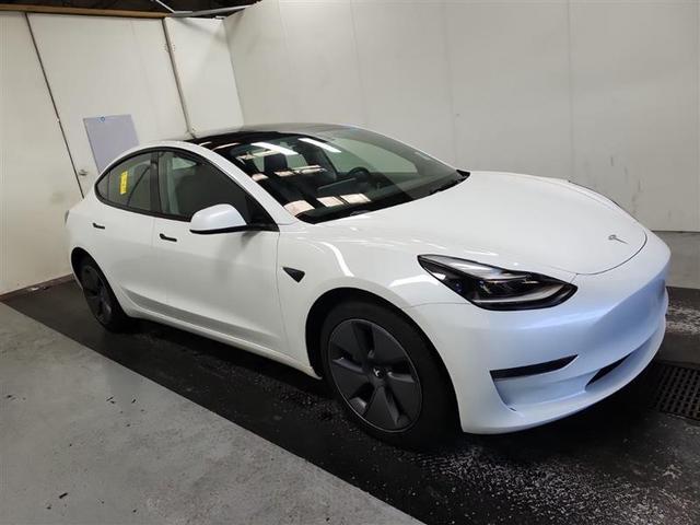 Photo of 2023 Pearl White Multi Tesla Model 3