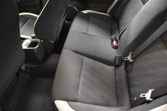 Photo of 2022 Aspen White Tricoat Nissan Versa