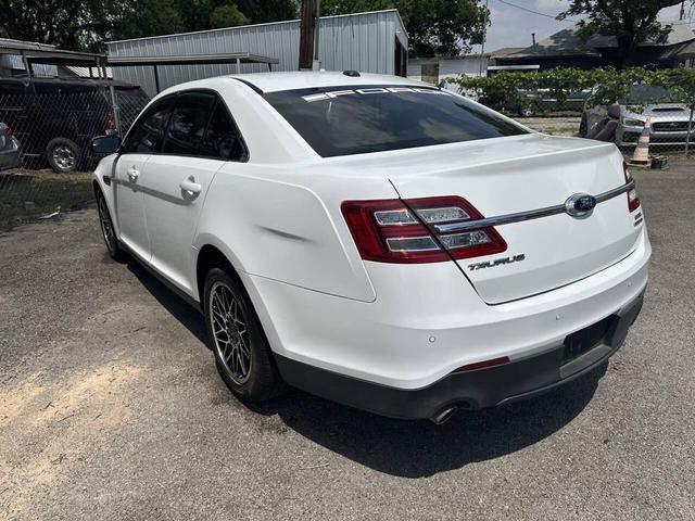 Photo of 2015 White Ford Taurus