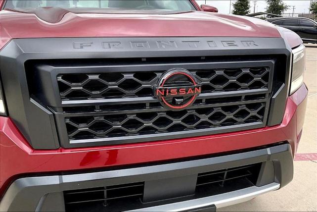 Photo of 2024 Cardinal Red Metallic Nissan Frontier