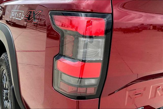 Photo of 2024 Cardinal Red Metallic Nissan Frontier