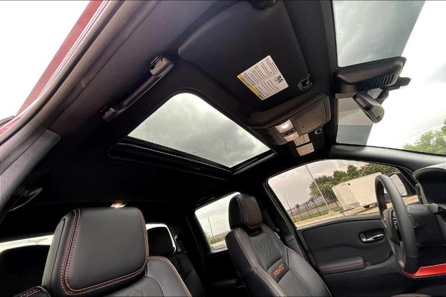 Photo of 2024 Cardinal Red Metallic Nissan Frontier