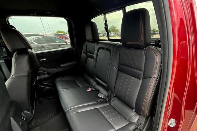 Photo of 2024 Cardinal Red Metallic Nissan Frontier