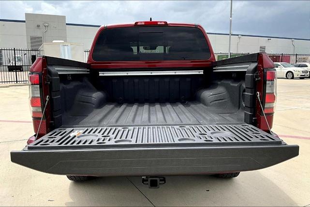 Photo of 2024 Cardinal Red Metallic Nissan Frontier