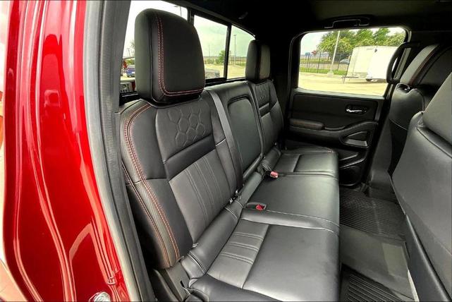 Photo of 2024 Cardinal Red Metallic Nissan Frontier