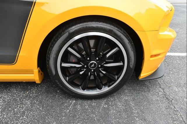 Photo of 2013 School Bus Yellow Ford Mustang