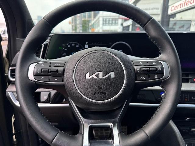 Photo of 2025 Jungle Green Kia Sportage