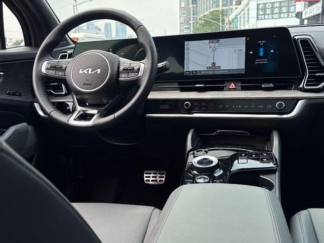 Photo of 2025 Jungle Green Kia Sportage