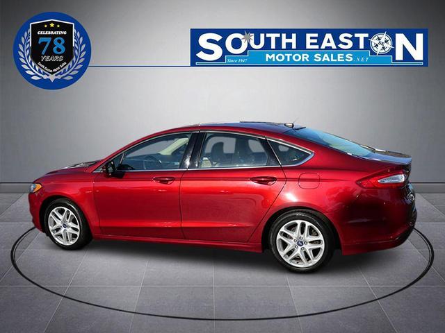 Photo of 2016 Ruby Red Metallic Tinted Clearcoat Ford Fusion