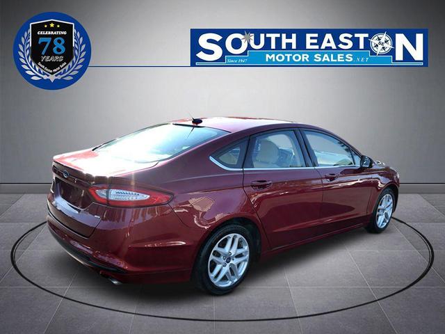 Photo of 2016 Ruby Red Metallic Tinted Clearcoat Ford Fusion