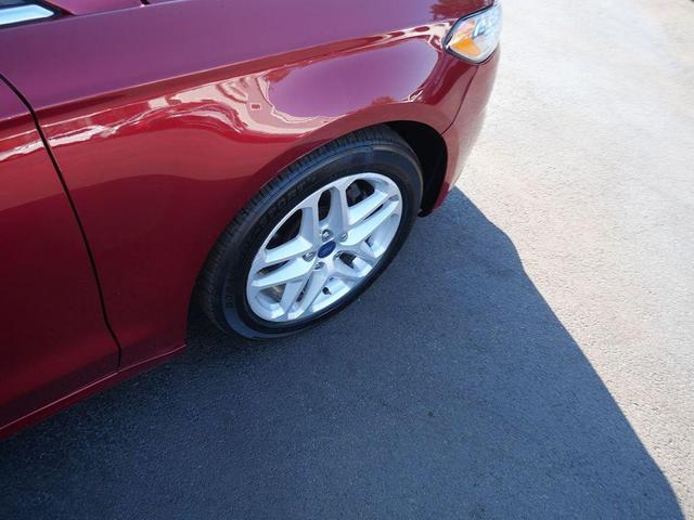 Photo of 2016 Ruby Red Metallic Tinted Clearcoat Ford Fusion