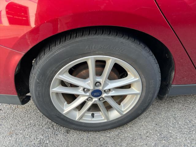 Photo of 2017 Ruby Red Metallic Tinted Clearcoat Ford Focus