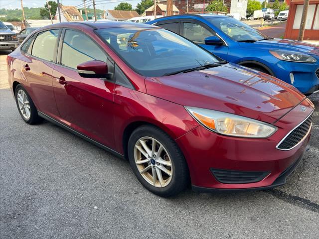 Photo of 2017 Ruby Red Metallic Tinted Clearcoat Ford Focus