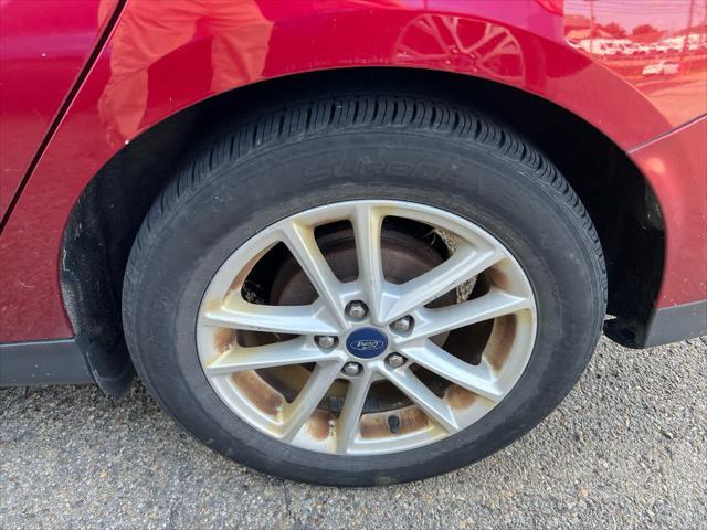 Photo of 2017 Ruby Red Metallic Tinted Clearcoat Ford Focus