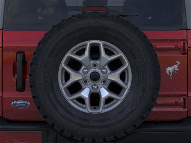 Photo of 2025 RUBY RED MET TNTD CLEARCOAT Ford Bronco
