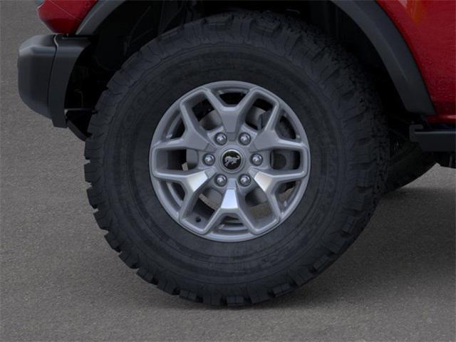 Photo of 2025 RUBY RED MET TNTD CLEARCOAT Ford Bronco