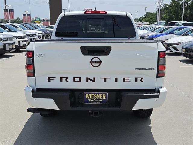 Photo of 2023 Glacier White Nissan Frontier