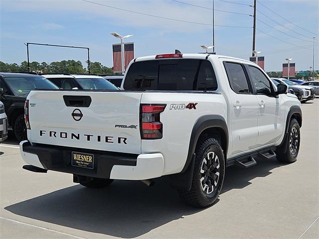 Photo of 2023 Glacier White Nissan Frontier