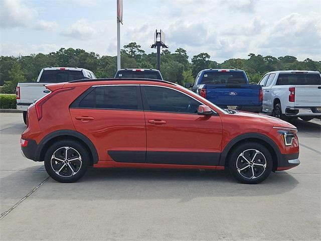 Photo of 2023 Fire Orange Kia Niro