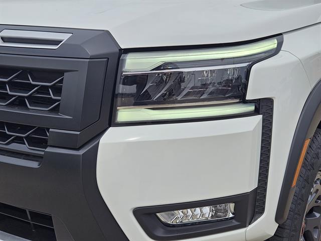 Photo of 2025 Glacier White Nissan Frontier