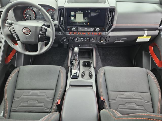 Photo of 2025 Glacier White Nissan Frontier
