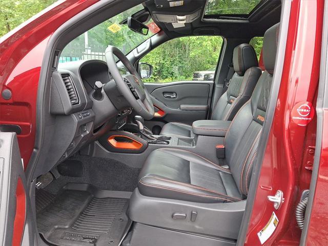 Photo of 2023 Cardinal Red Metallic Tricoat Nissan Frontier