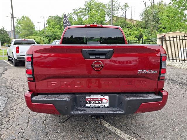 Photo of 2023 Cardinal Red Metallic Tricoat Nissan Frontier