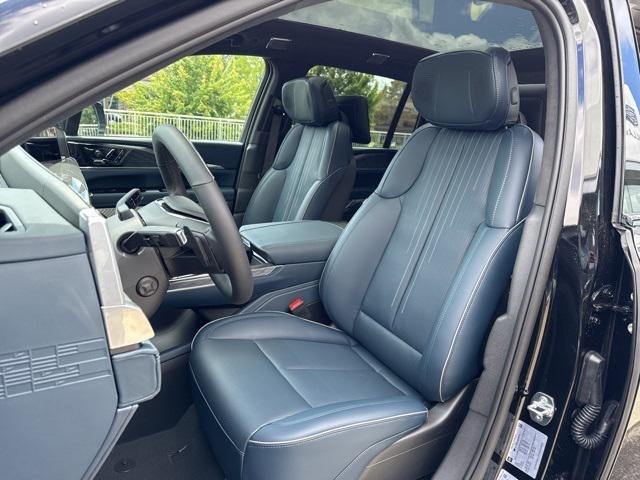 Photo of 2025 Black Raven Cadillac Escalade IQ