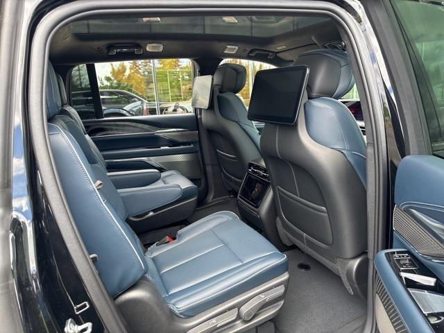 Photo of 2025 Black Raven Cadillac Escalade IQ