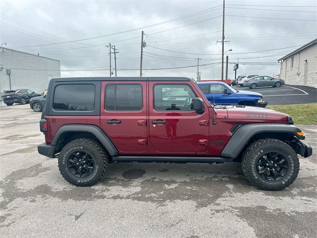 Photo of 2021 Snazzberry Pearlcoat Jeep Wrangler