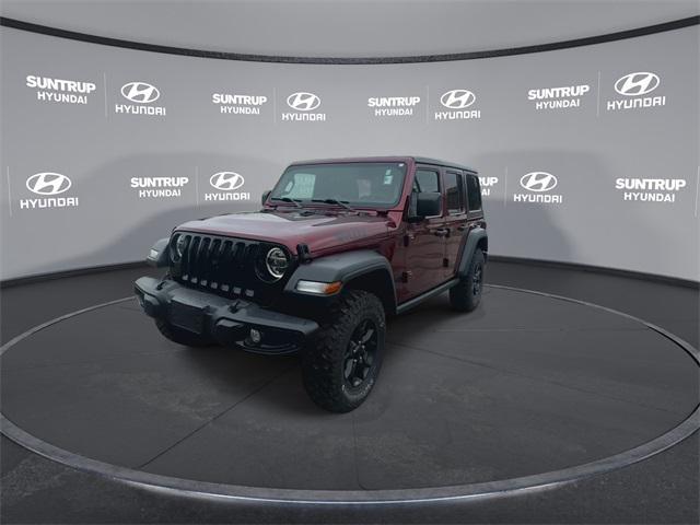 Photo of 2021 Snazzberry Pearlcoat Jeep Wrangler