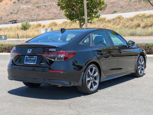 Photo of 2025 Boost Blue Pearl Honda Civic Hybrid