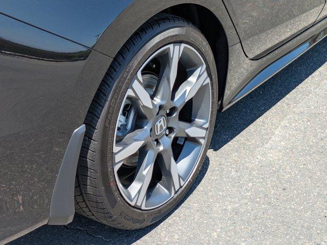 Photo of 2025 Boost Blue Pearl Honda Civic Hybrid