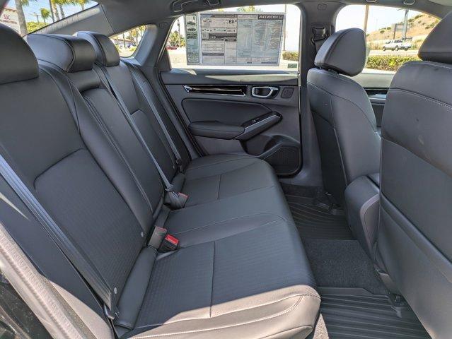 Photo of 2025 Boost Blue Pearl Honda Civic Hybrid