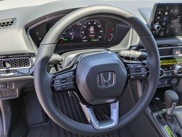 Photo of 2025 Boost Blue Pearl Honda Civic Hybrid