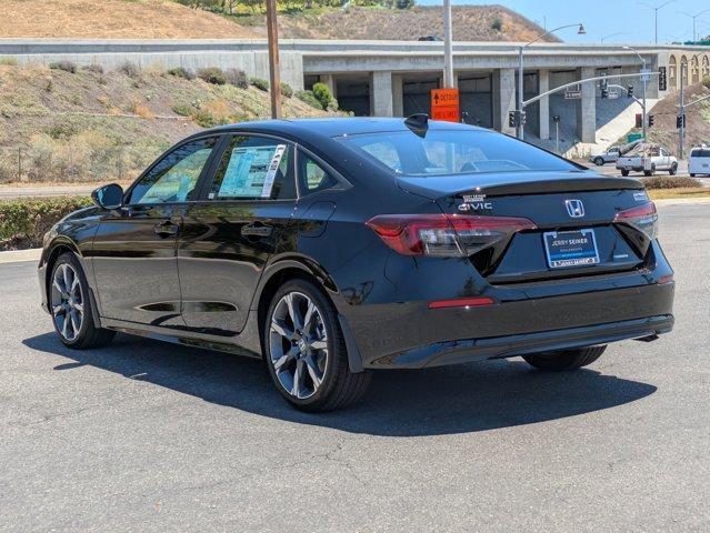 Photo of 2025 Boost Blue Pearl Honda Civic Hybrid