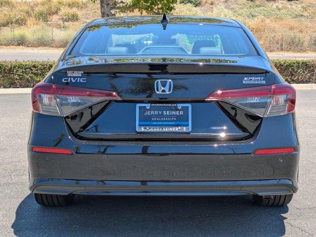 Photo of 2025 Boost Blue Pearl Honda Civic Hybrid