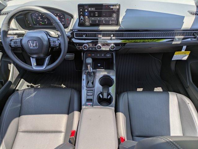 Photo of 2025 Boost Blue Pearl Honda Civic Hybrid
