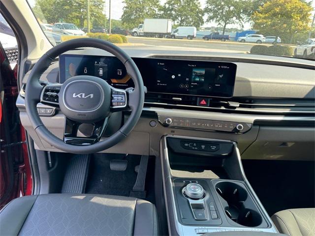 Photo of 2026 Flare Red Kia Carnival Hybrid