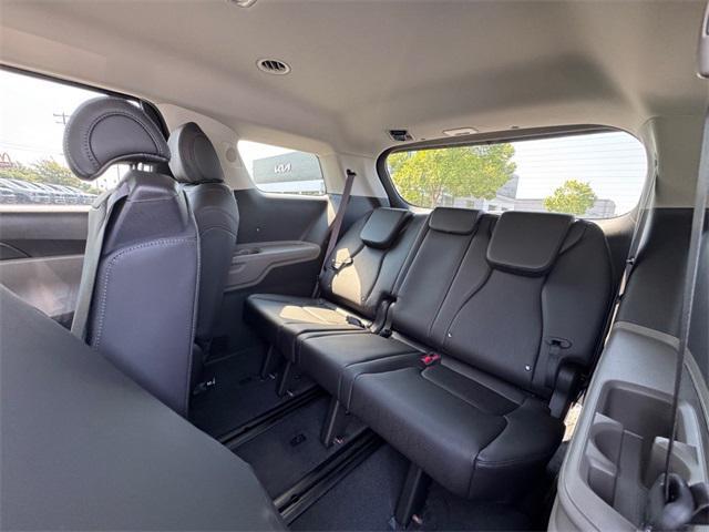 Photo of 2026 Flare Red Kia Carnival Hybrid
