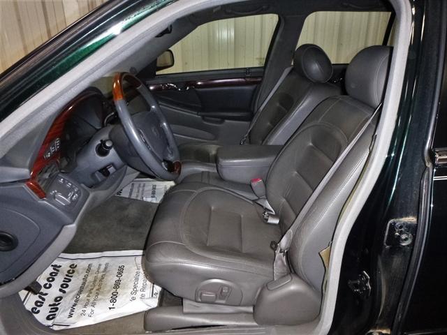 Photo of 2000 Polo Green Cadillac DeVille