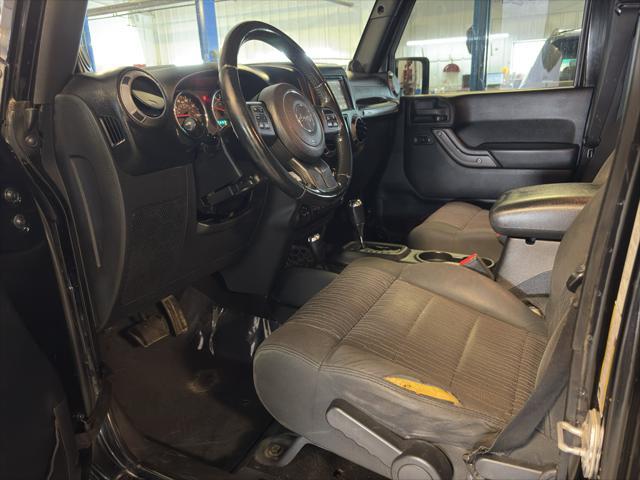 Photo of 2011 Black Clearcoat Jeep Wrangler Unlimited
