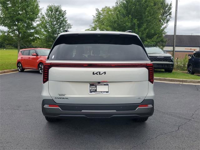 Photo of 2026 Ivory Silver Kia Carnival Hybrid