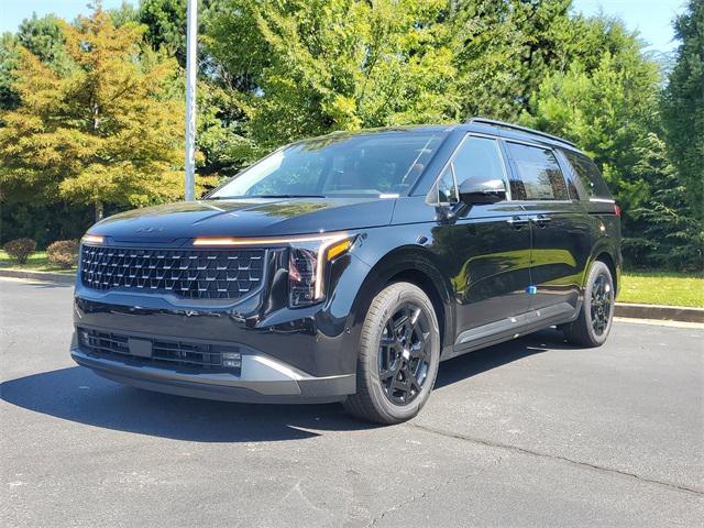 Photo of 2026 Aurora Black Pearl Kia Carnival Hybrid