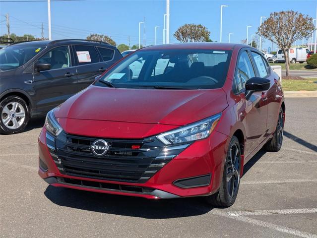 Photo of 2025 Scarlet Ember Tintcoat Nissan Versa